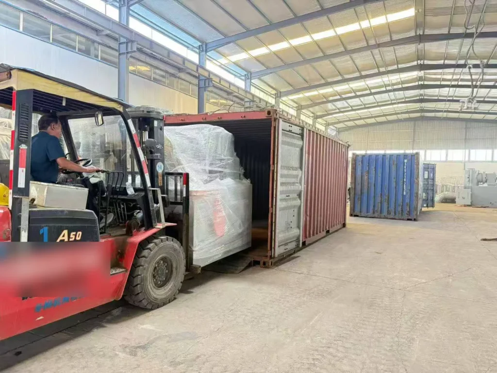Incinerator being loaded into a container for export