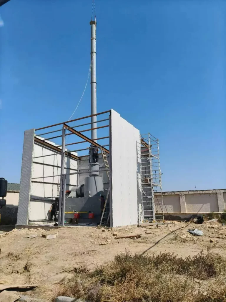 On-site incinerator installation with chimney and shelter